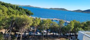 a view of a body of water with trees at Apartman "Cvita" in Drage +8 photos
