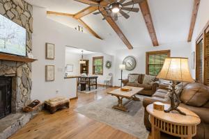 a living room with a couch and a fireplace at Fehrway to Heaven in Blowing Rock