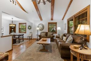 a living room with a couch and a table at Fehrway to Heaven in Blowing Rock