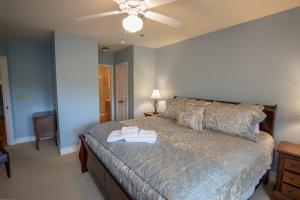 a bedroom with a bed and a ceiling fan at Havens Rest in Valle Crucis