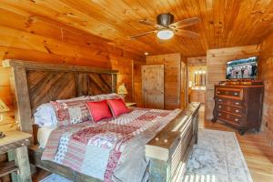 a bedroom with a bed and a ceiling fan at Hilltop Haven in Boone +27 photos