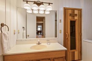 a bathroom with a sink and a large mirror at Longview Lodge in Boone +49 photos
