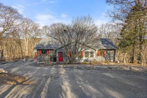 a house with a red door on a road at Longview Lodge in Boone