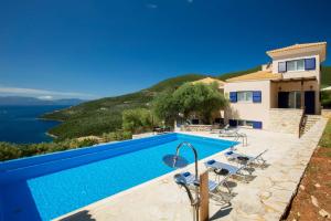 a villa with a swimming pool with a view at Villa Thaleia in Sivota