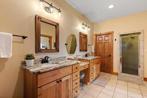 a bathroom with two sinks and a shower at Resting on the Ridge in Beech Mountain