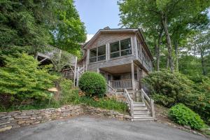 a wooden house with stairs and a porch at Serendipity in Blowing Rock