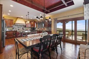 a kitchen with a table and chairs in a room at Sunset Beech in Beech Mountain