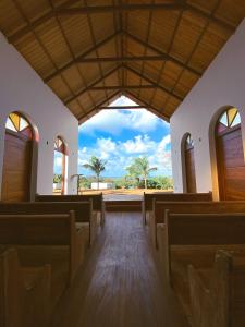 a view from the aisle of a church at Pousada Luar da Ilha in Fernando de Noronha