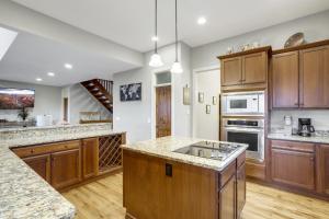 a large kitchen with wooden cabinets and granite counter tops at The Pointe at North View in Banner Elk