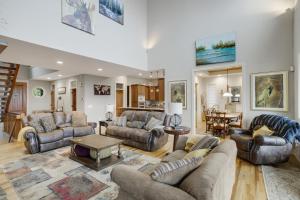 a living room with couches and a table at The Pointe at North View in Banner Elk
