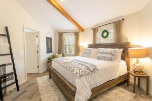 a bedroom with a large bed and a window at Top Of The Hill in Seven Devils