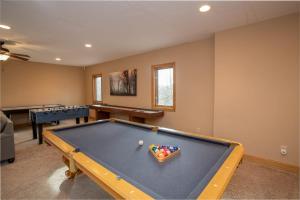 a billiard room with a pool table in a house at Villa Costalotta in Sugar Mountain