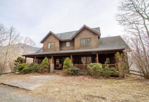 a wooden house with a gambrel roof at Villa Costalotta in Sugar Mountain