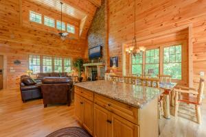 a kitchen and living room in a log cabin at Valle Crucis Overlook in Banner Elk