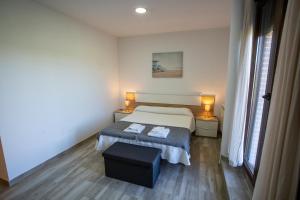Łóżko lub łóżka w pokoju w obiekcie La casita del abuelo
