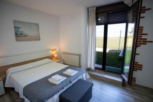 Łóżko lub łóżka w pokoju w obiekcie La casita del abuelo