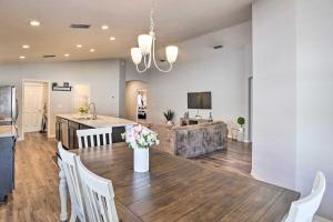 a dining room and kitchen with a table and chairs at Eagle Lake Home Less Than 7 Mi to Legoland! in Eagle Lake