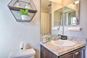 a bathroom with a sink and a mirror at Eagle Lake Home Less Than 7 Mi to Legoland! in Eagle Lake +19 photos