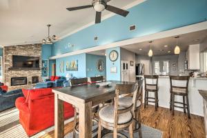 a dining room and living room with a table and chairs at Lakefront Livingston Home with Grill and Views! in Blanchard