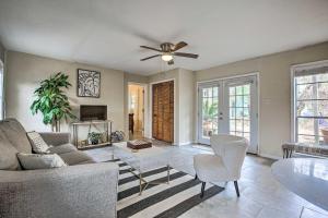 a living room with a couch and a ceiling fan at Walk to Coast Galveston Bay Retreat with Grill in San Leon