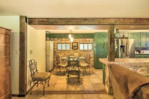 a kitchen and dining room with a table and chairs at Scenic Cottage with Views, 17 mi to San Antonio! in San Antonio