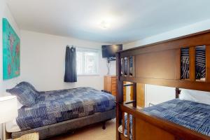 a bedroom with two beds and a bunk bed at The Sanctuary Bldg 5 #7-8 in Winter Park +55 photos