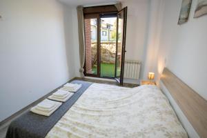 Łóżko lub łóżka w pokoju w obiekcie La casita del abuelo