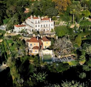 an aerial view of a large house with trees at Suites at the Villas by Quinta da Bella Vista in Sintra
