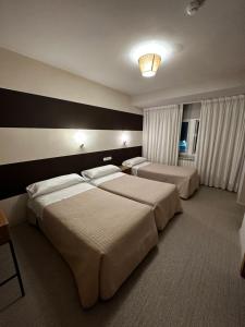 A bed or beds in a room at San Luis