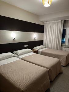 A bed or beds in a room at San Luis