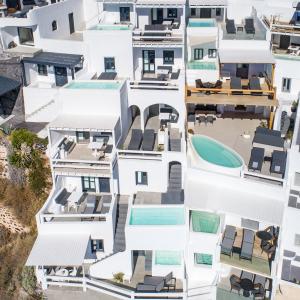 an aerial view of a white building at Aqua Luxury Suites Santorini in Imerovigli
