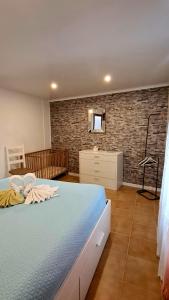 Ένα ή περισσότερα κρεβάτια σε δωμάτιο στο Apartamento Terra e Mar I +10 φωτογραφίες