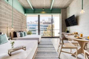 a living room with a couch and a table at Collections by ULIV Polanco in Mexico City