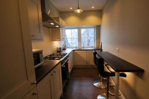 A kitchen or kitchenette at Comrie Old Schoolhouse