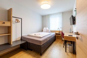 Postel nebo postele na pokoji v ubytování Hotel Garni Traube