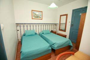Uma cama ou camas num quarto em Residencial Joao XXI