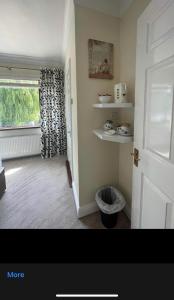 a room with a door and a window with a windowgiene at Robin Hill Bed and Breakfast in Curracloe