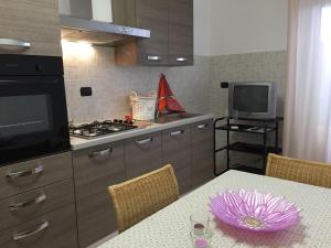 A kitchen or kitchenette at Welcome Traveller Borgo Cavour Apartaments