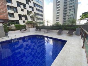 Bazén v ubytování Condomínio Costa do Sol nebo v jeho okolí