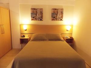 Postel nebo postele na pokoji v ubytování Itajubá Flat Hotel