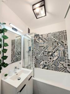 A bathroom at AwesHome City Apartment
