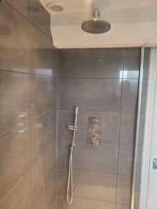 a shower with a glass door in a bathroom at Large Kingsize ensuite in Kingswood, Bristol, BS15 in Kingswood