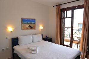A bed or beds in a room at Pansion Evi