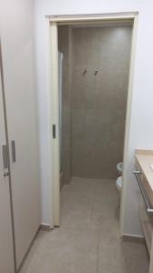 a bathroom with a shower and a toilet at Patagonia Home in Cipolletti +8 photos