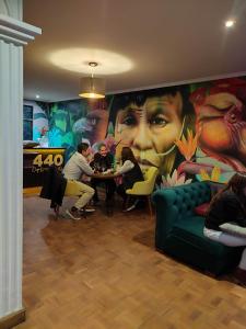 a group of people sitting at a table in a restaurant at 440 Café Lounge y Hostel in La Paz