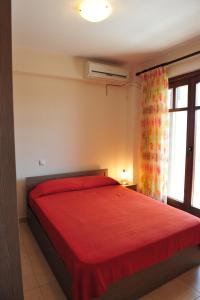 A bed or beds in a room at Pansion Evi