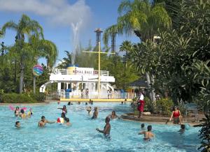 a group of people in a pool at a water park at Universal's Loews Royal Pacific Resort in Orlando
