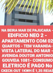 una señal frente a un edificio alto en NA BEIRA MAR DE PAJUCARA - EDIFICIO NEO 2 - TEM VARANDA - VISTA LATERAL DO MAR- APARTAMENTO COM 02 QUARTOS - AVENIDA DOUTOR ANTONIO GOUVEIA 1081- CONSUMO ELETRICO É PAGO No CKECK-OUT 1KWH É 1,35 REIAS, en Maceió