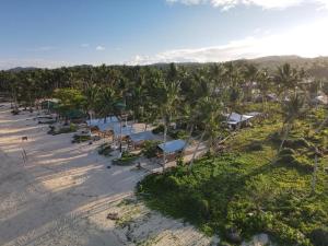 an aerial view of a beach with palm trees at 3B Beach Resort Alegria in Santa Monica