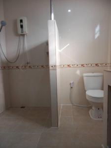 a bathroom with a toilet and a shower stall at Welcome holiday in Chiang Khan +14 photos